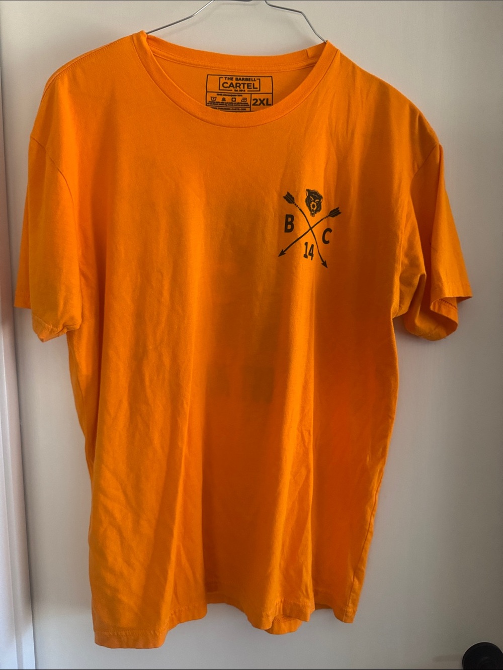 The Barbell Cartel - Bright Orange Short Sleeve Tee with Black Chest Graphic